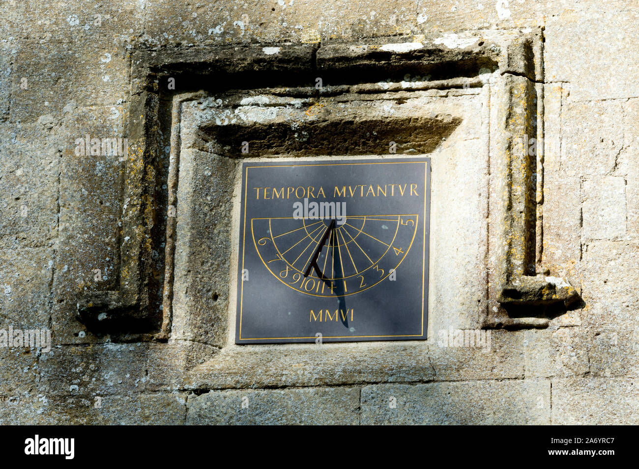 A sundial on the tower of St. Kenelm`s Church, Enstone, Oxfordshire, England, UK Stock Photo